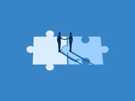 puzzle pieces with person standing on each piece, holding hands.